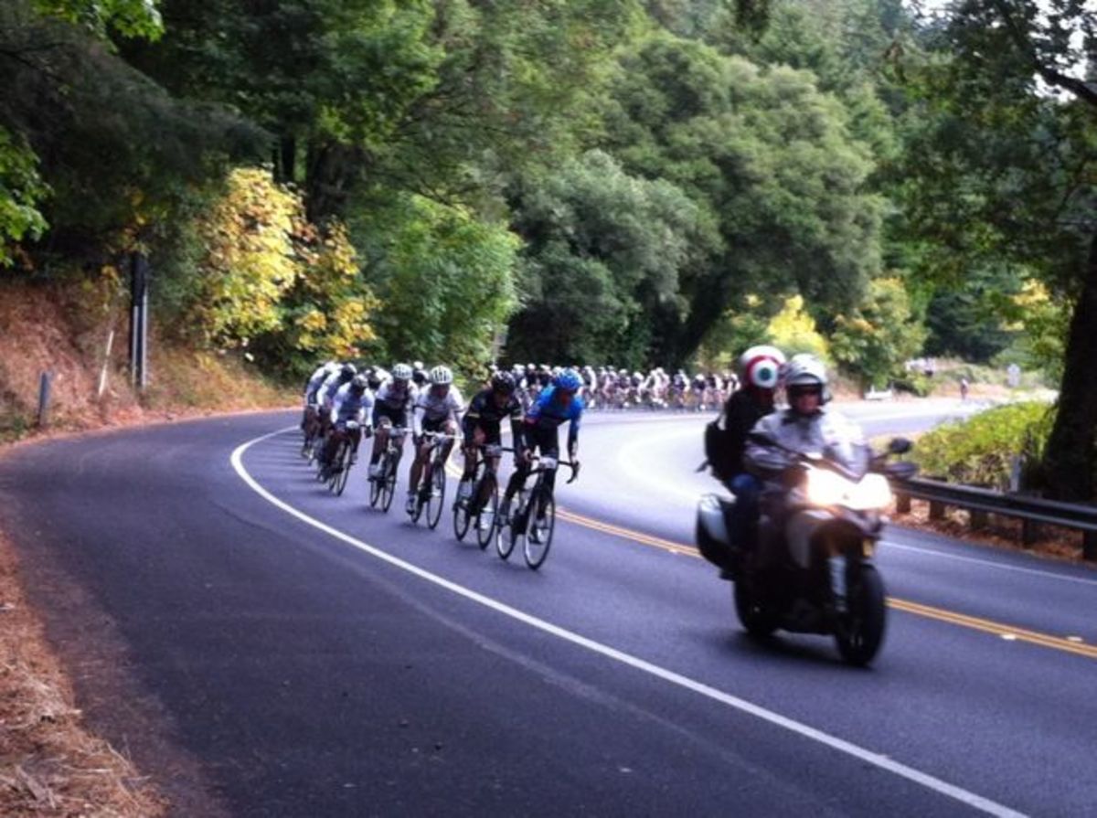 gran-fondo-07 Tom Danielson leads the third group on the road. Don't worry, he wasn't there for long. A quick little session behind the lead moto at over 40-miles-per-hour had him flying by yours truly in the chase group and up to the leaders in no time.