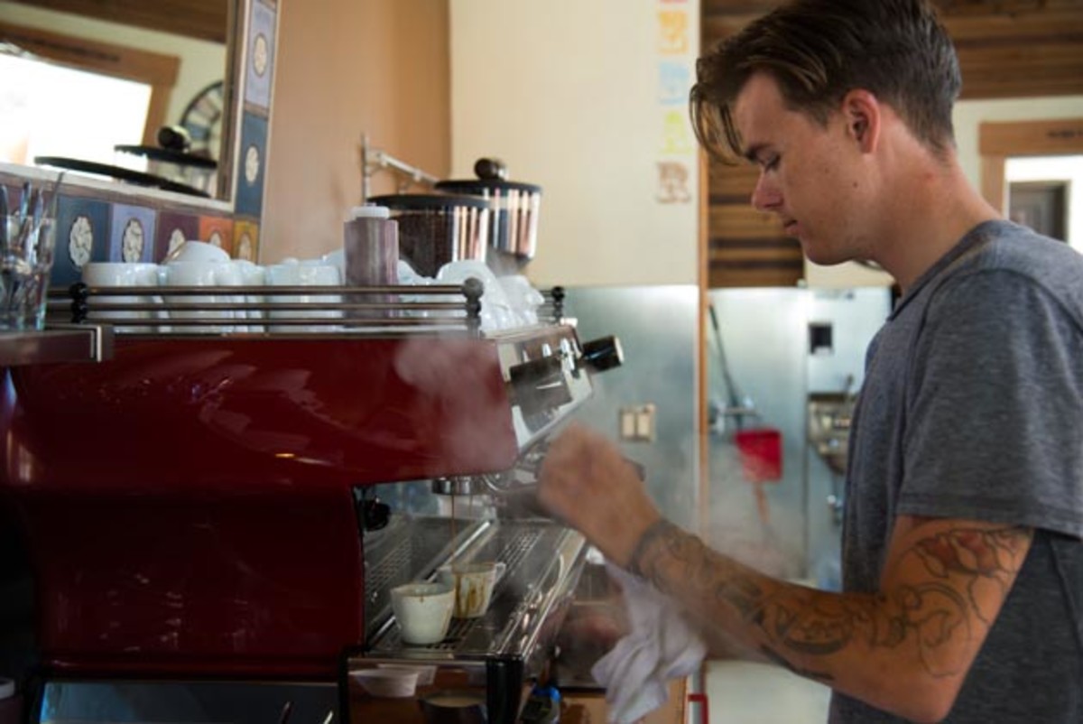 coffee-13 Tosh Clements, steaming up a macchiato at Handlebar Coffee. Clements is also a bike racer for Stage17 Racing.