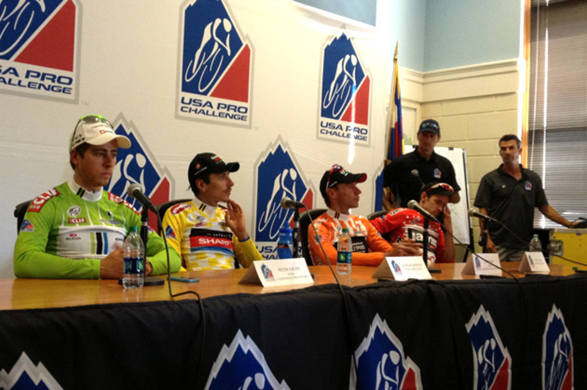 press-conference Dazed and un-enthused. The heat of a long day is evident at the post-stage press conference.