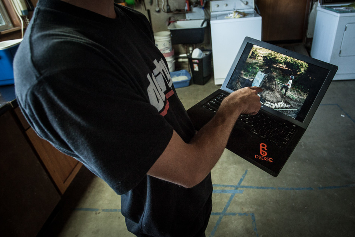 A young Mullen shows photos of an even younger Mullen digging the first jump he ever built in his backyard.