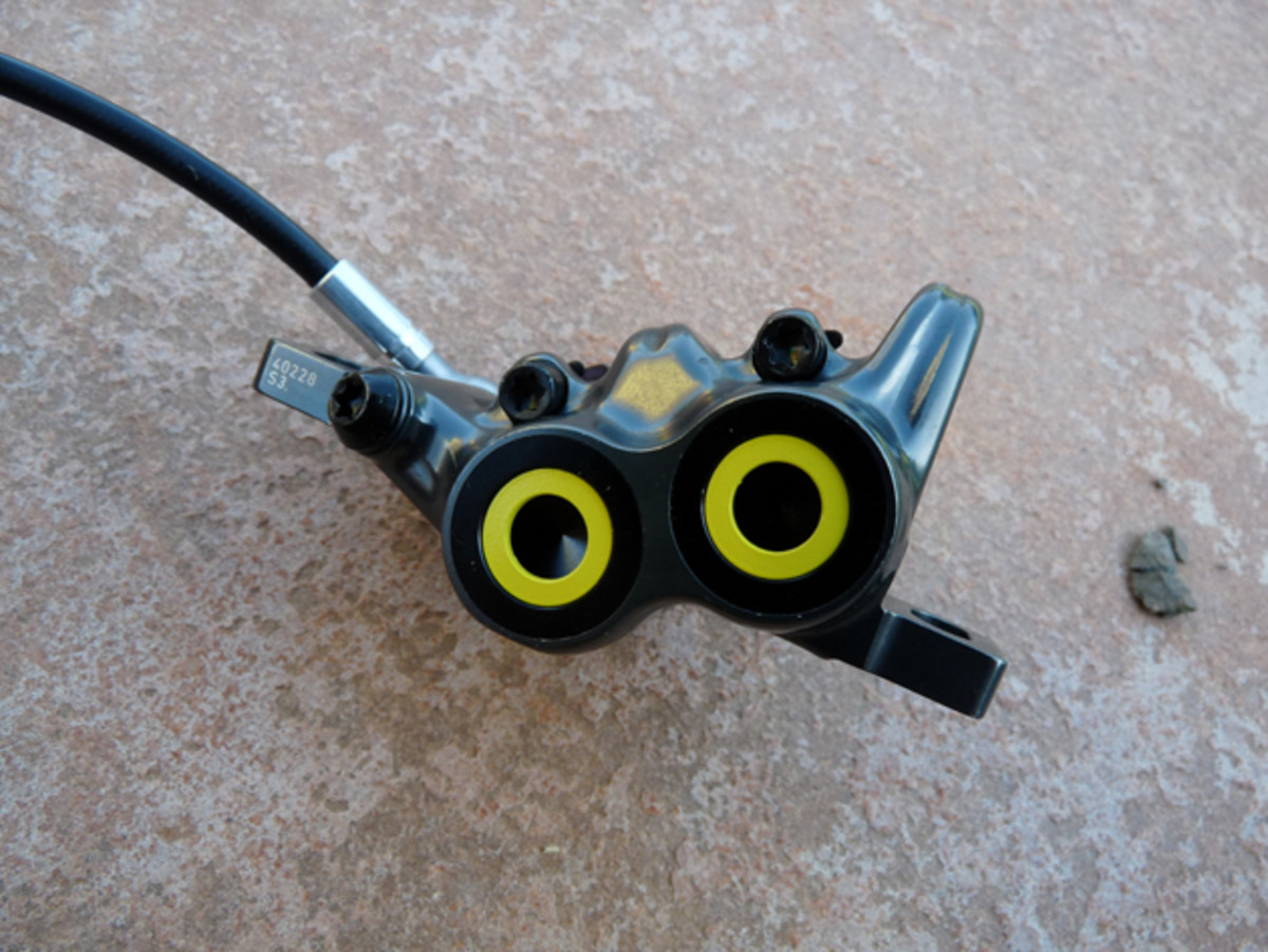 Magura's new four-piston calipers use trickle-down technology from its motorcycle brakes.