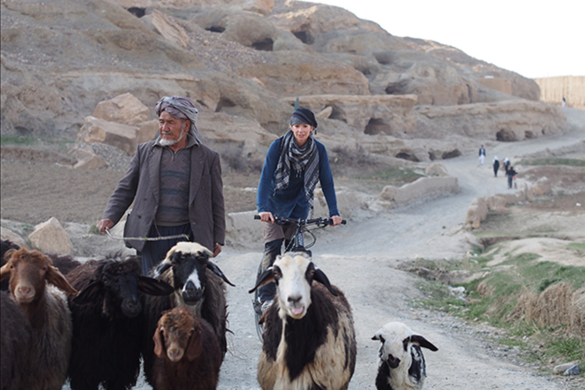 Shannon Galpin waits her turn on a dirt road in Afghanistan.