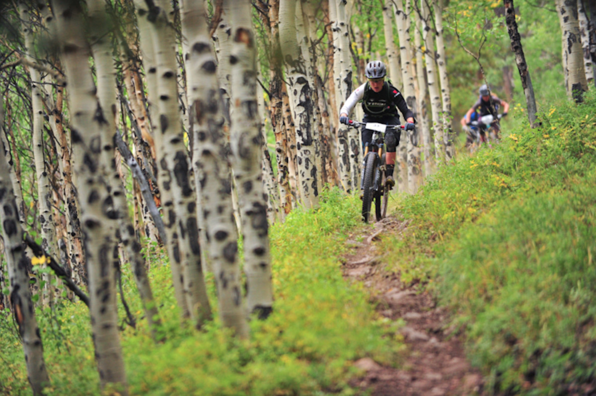Heather Irmiger rides through an Aspen grove during stage 3 on Roaring Judy.