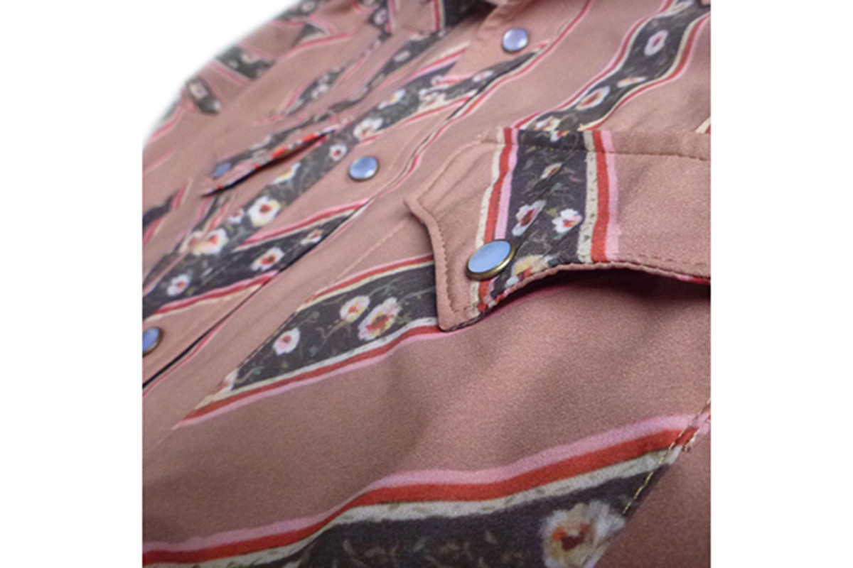 The Western shirts feature pearl snaps and cuffed sleeves.