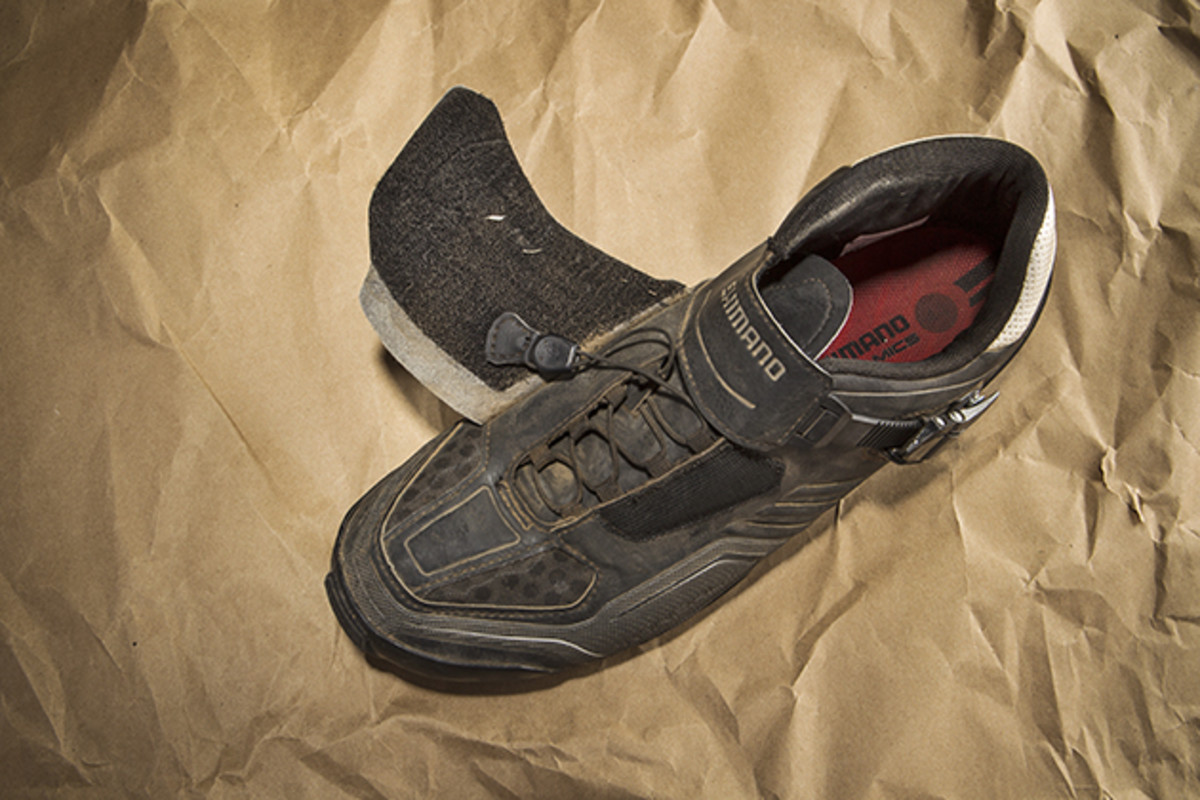The end of the quick lace has Velcro on it, so when you're done pulling it tight you can slap it on the underside of the flap, preventing stray laces.
