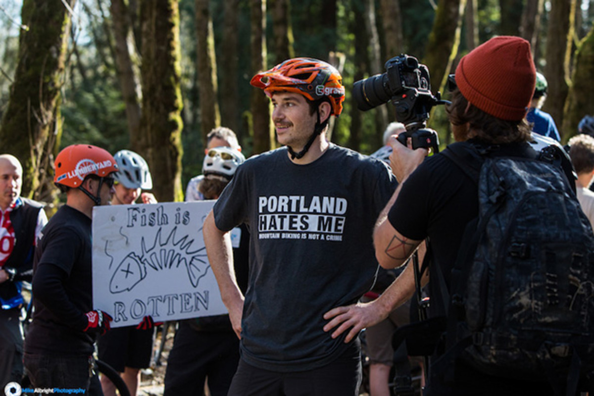 Charlie Sponsol gives the mountain biker perspective to Portland media during a rally to protest the ban on mountain biking at River View Natural Area, the primary in-city riding spot for Portland's mountain bike community.