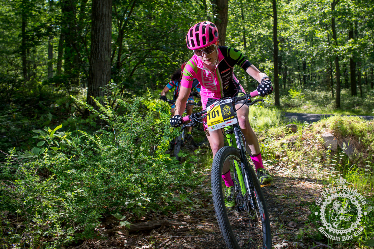 Vicki Barclay (Stan’s NoTubes Elite Women’s Team) heads off the road and onto a section of singletrack.