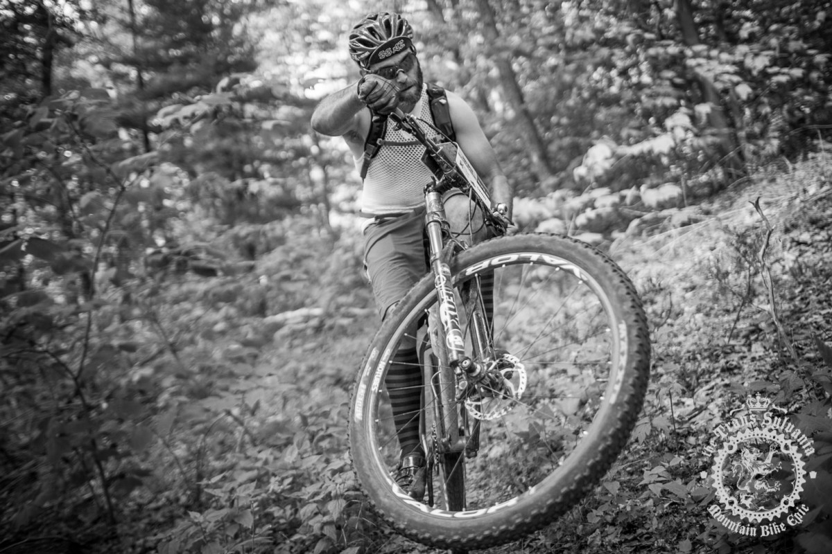 Dejay Birtch (Stan's NoTubes/Rudi Cycling Art/Osprey) pulls a wheelie.