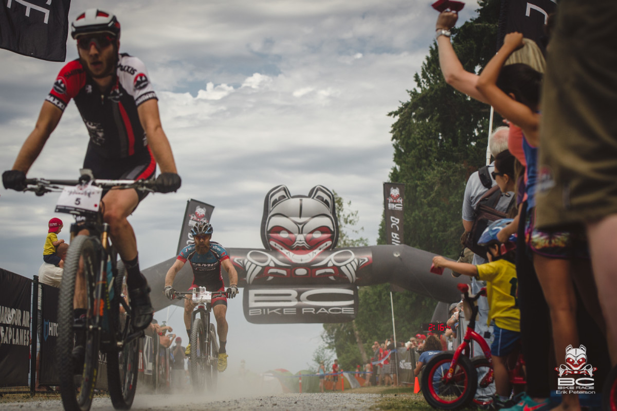 A long hot battle brings Quin Moberg and Thomas Turner back to the beach finish line. Photo: Erik Peterson