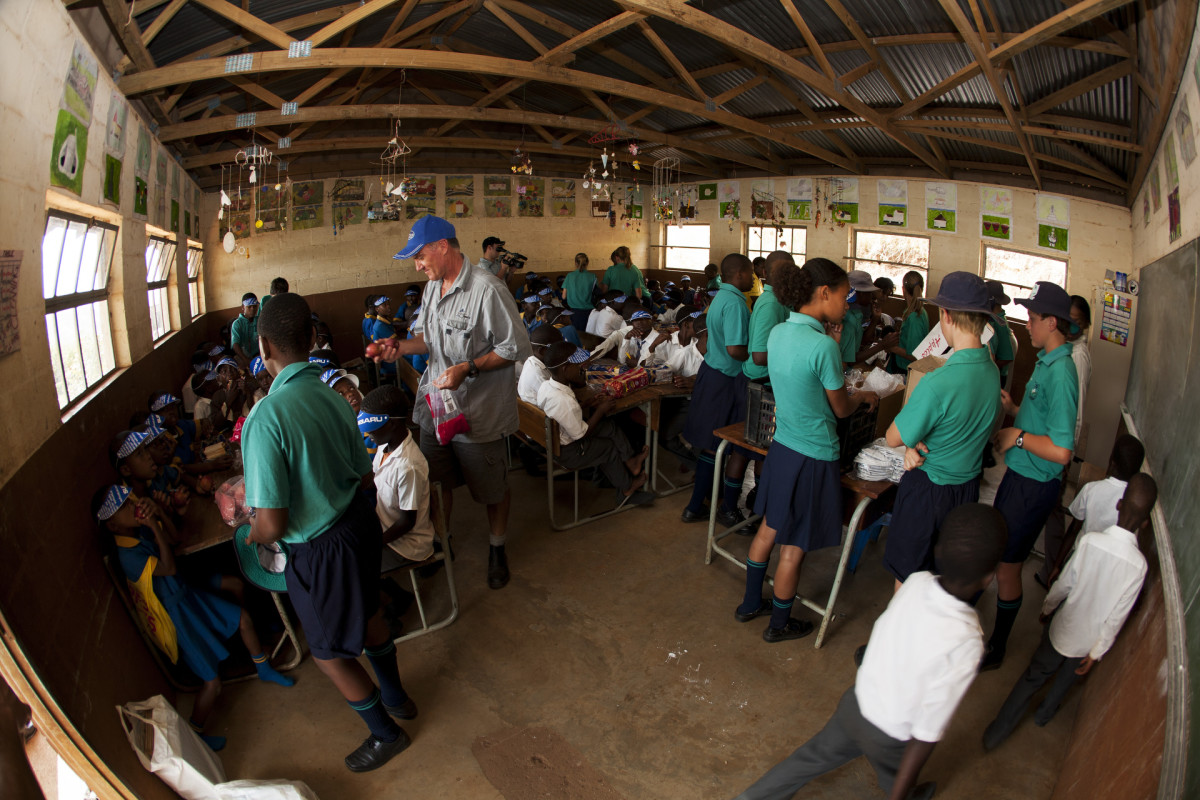 Farmer Glen helps hand out food at the Msayana School in the Umkomaas Valley.
