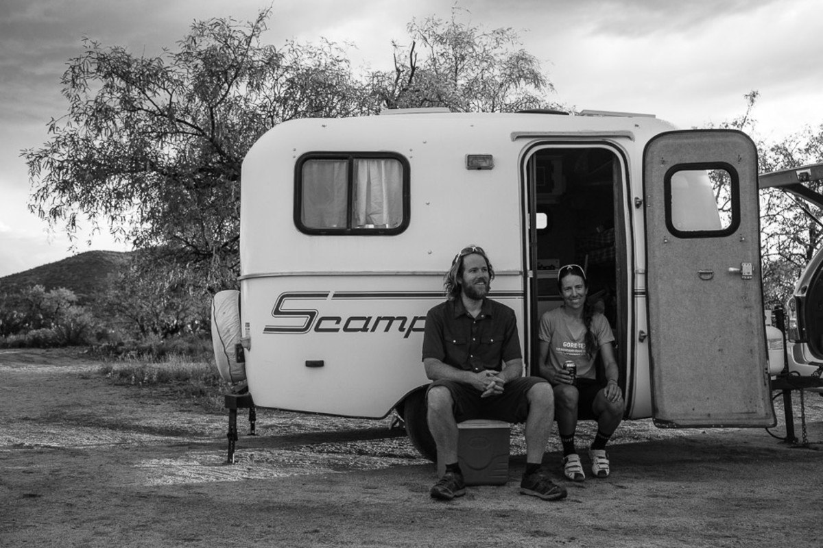 Scott, Eszter and the Scamp trailer they call home.