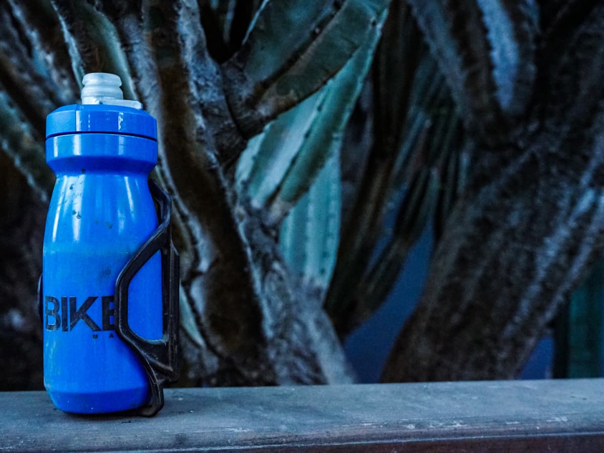 Bottle cage for camelbak podium top