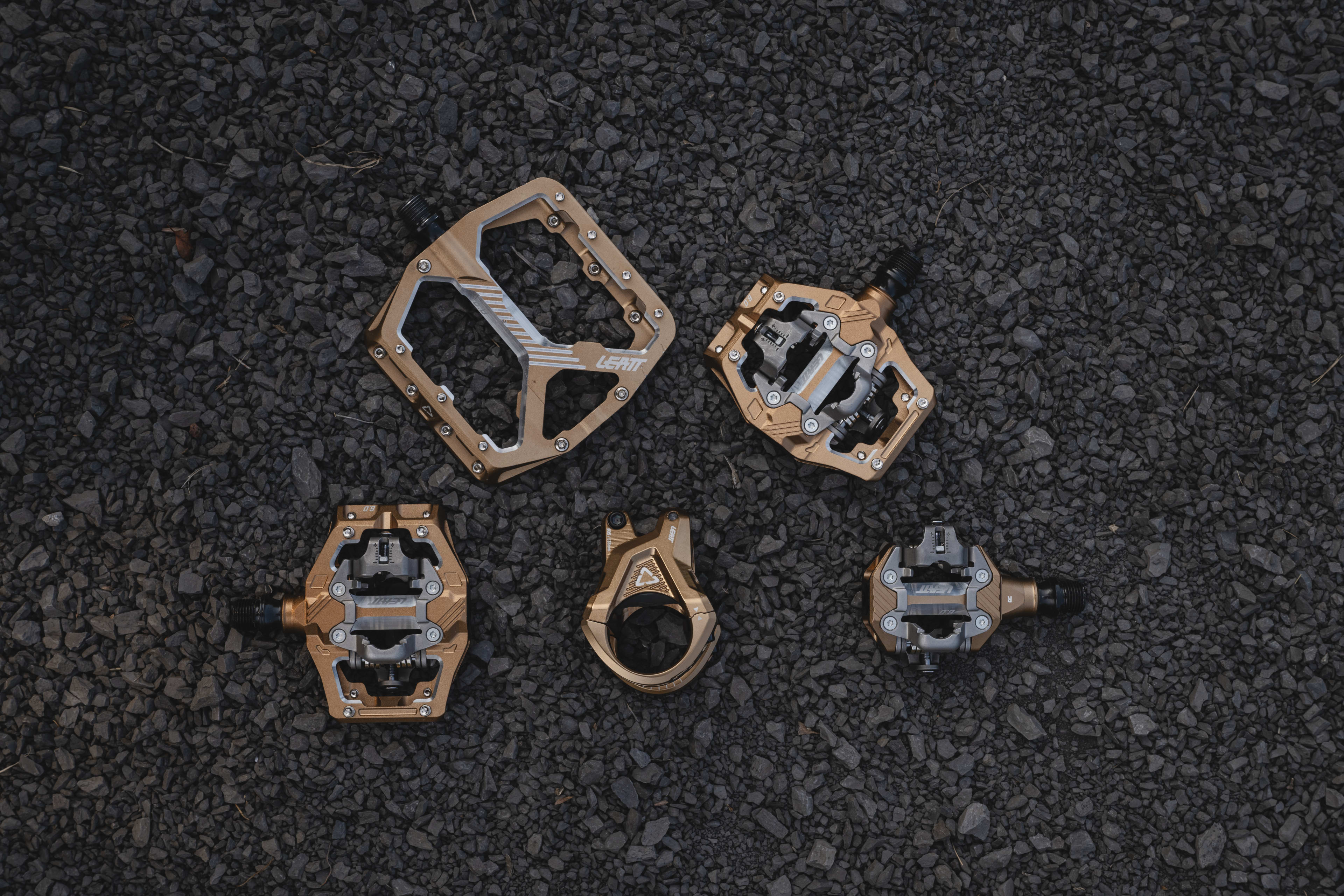 Mountain bike components lying on gravel