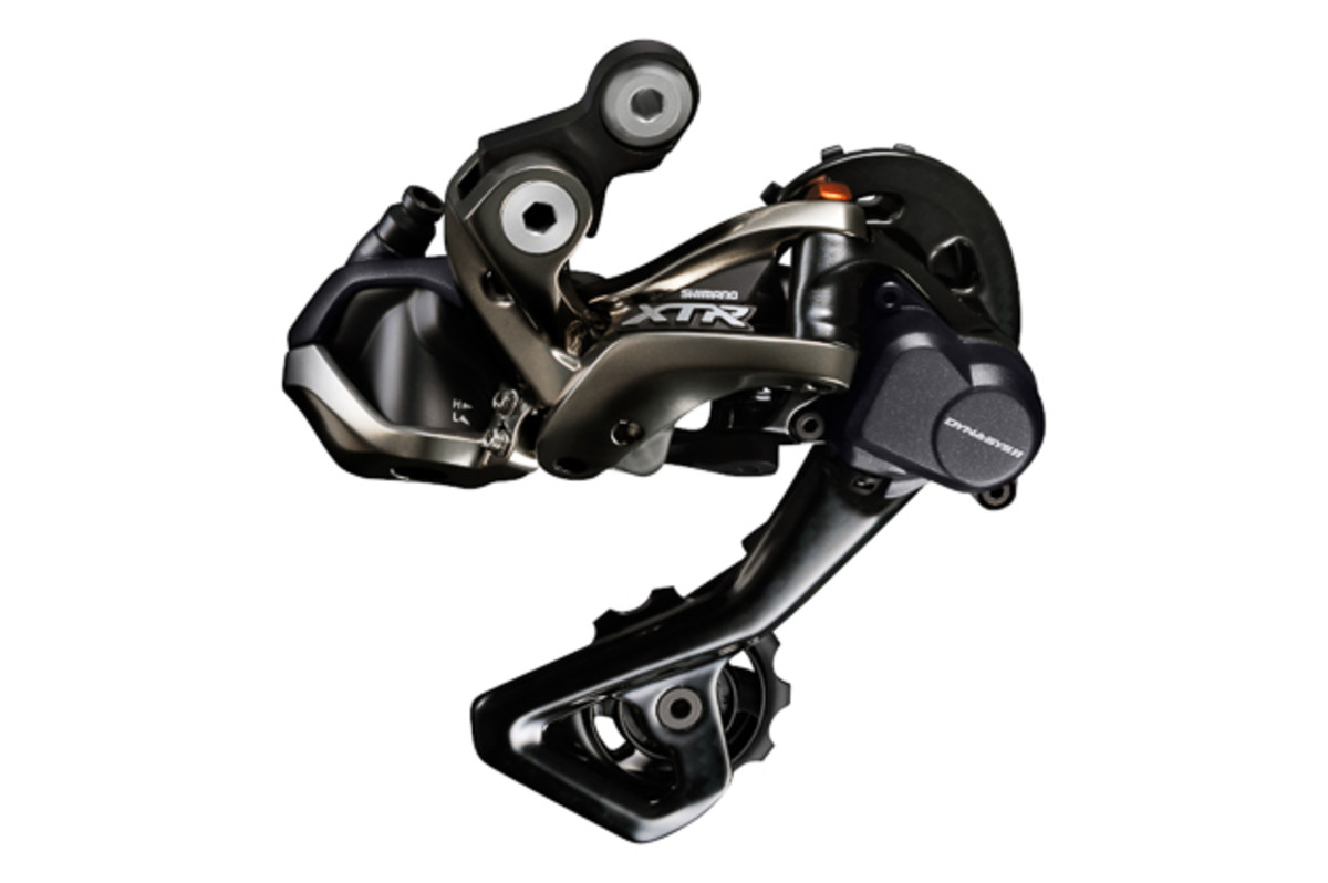 The Di2 rear derailleur is actually pretty stealthy considering that there's a powerful servo motor hidden inside. The weight of motor sits on the other side of the fixing bolt, acting as a counterweight for the derailleur. Shimano says it actually gets bounced around less than the mechanical one because of this. Also, the clutch force is now externally adjustable, a definite bonus.