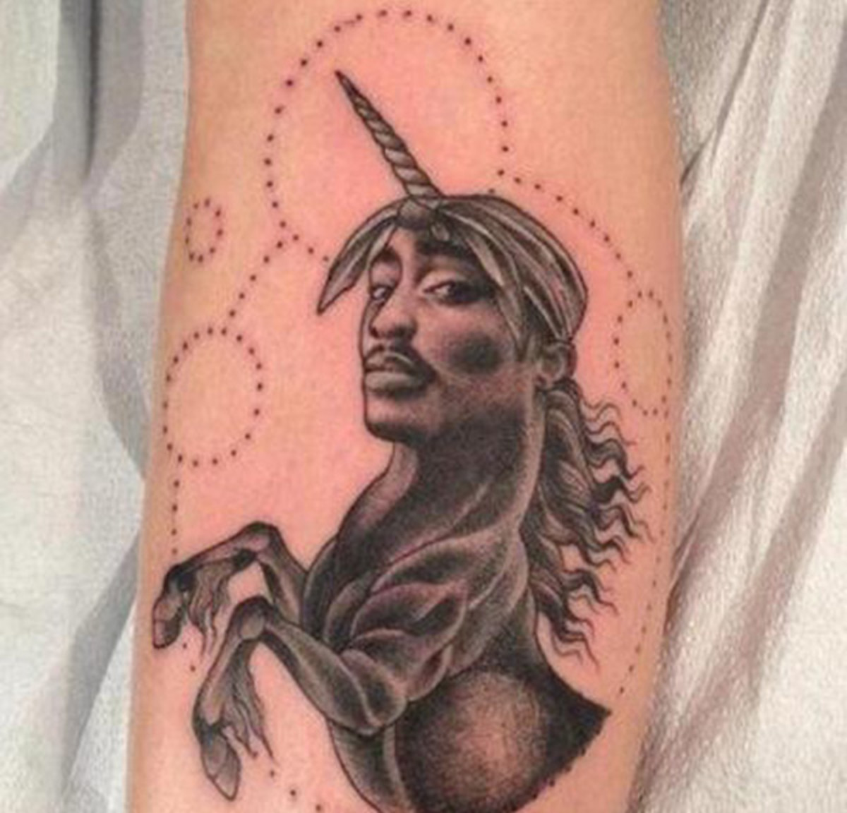 The dilemma we all face: should we get a tattoo of Tupac or a tattoo of a unicorn? But wait! Here's a third option: a Tupacicorn. Brilliant.