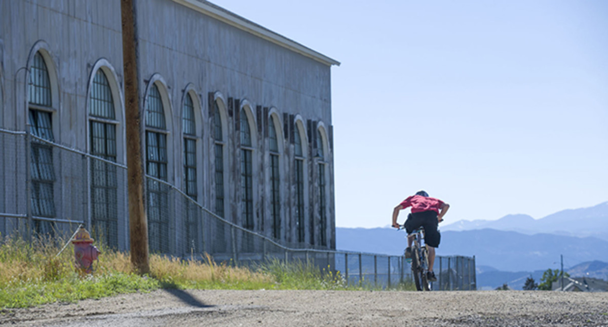 The course passed the motor house for the Con Mine, which sits a mile high with shafts a mile deep. The wind affected riders on the wide-open upper sections.
