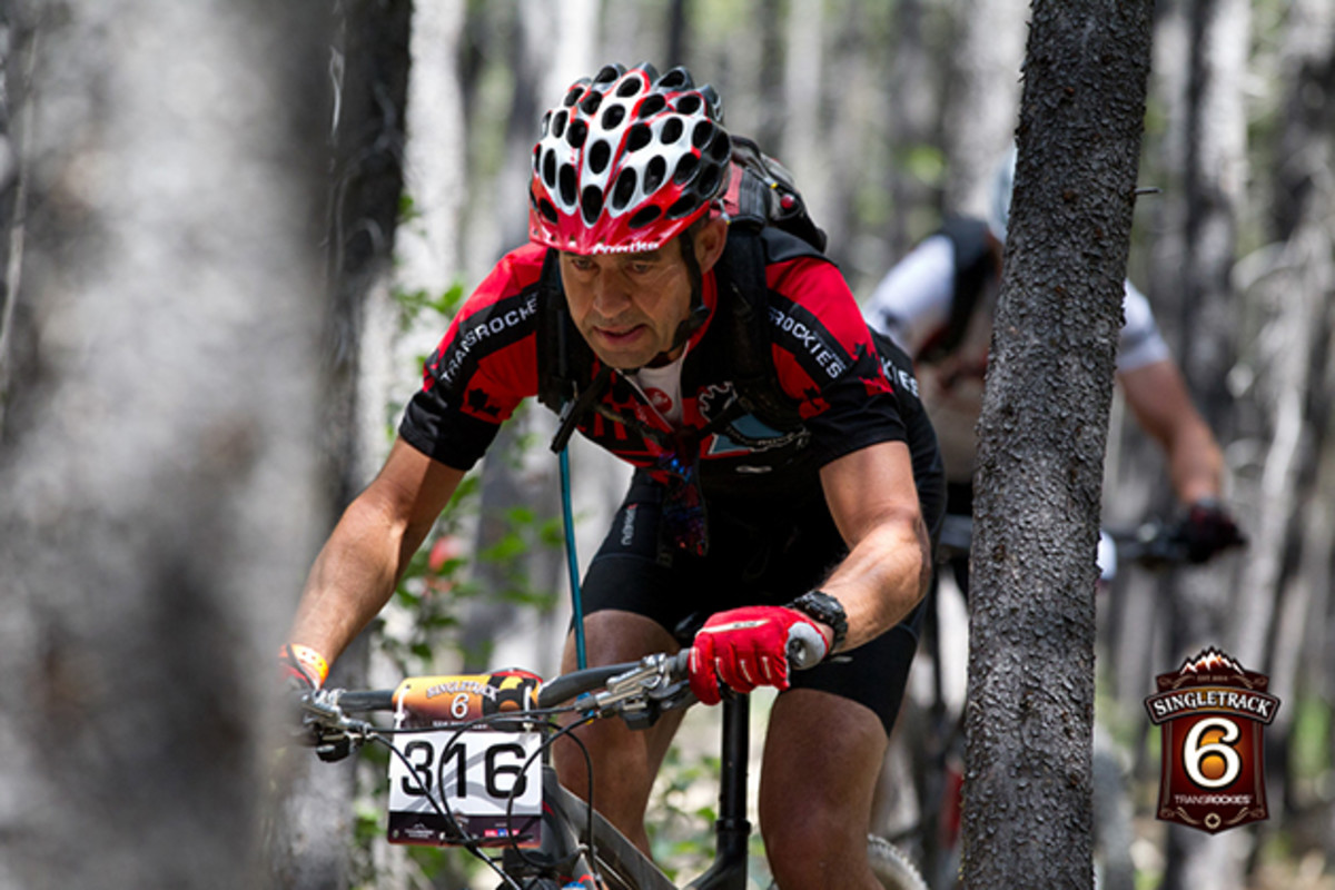 A rider in the open men 40+ category does his best to not get too up close and personal with some of the trees. With Handlebars getting wider every year, there are numerous bark scars throughout the trail network where riders got a little too friendly with the locals.