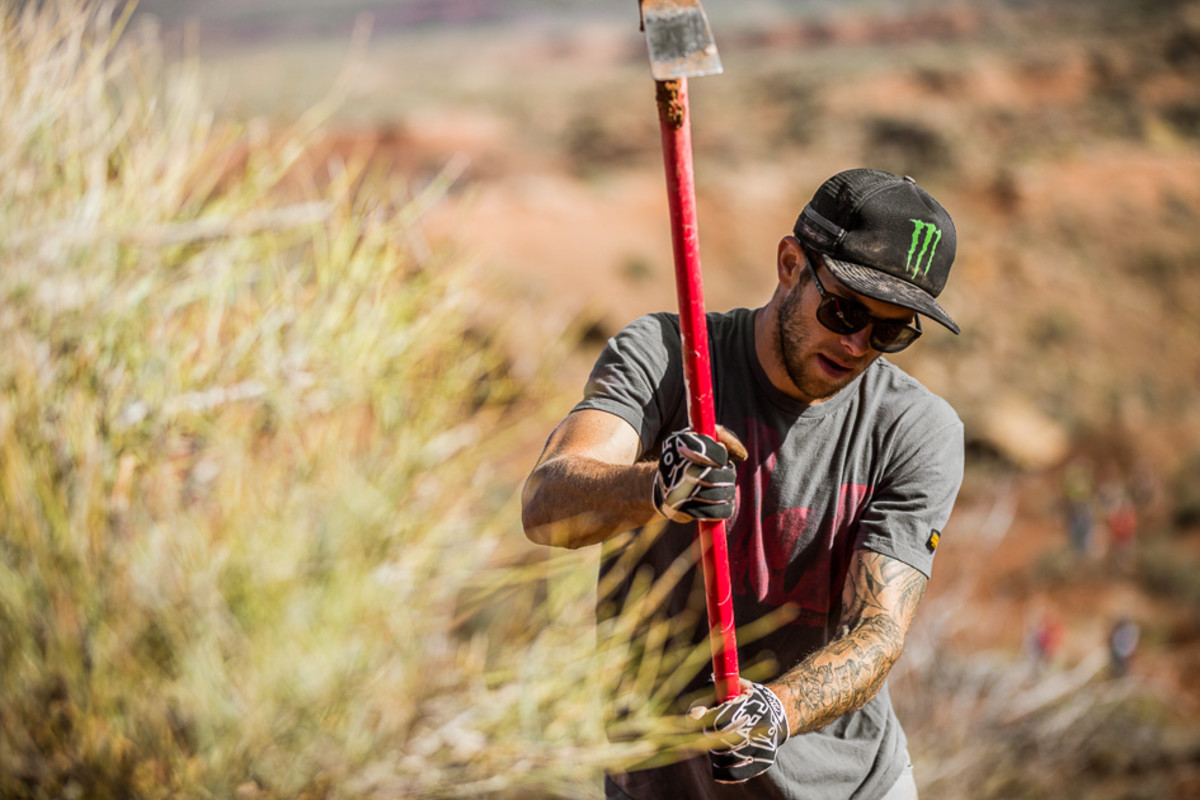 The world's best big-mountain riders were getting their hands dirty this morning in an effort to repair their rained-drenched lines, and one-time Rampage winner Cam Zink was no exception.