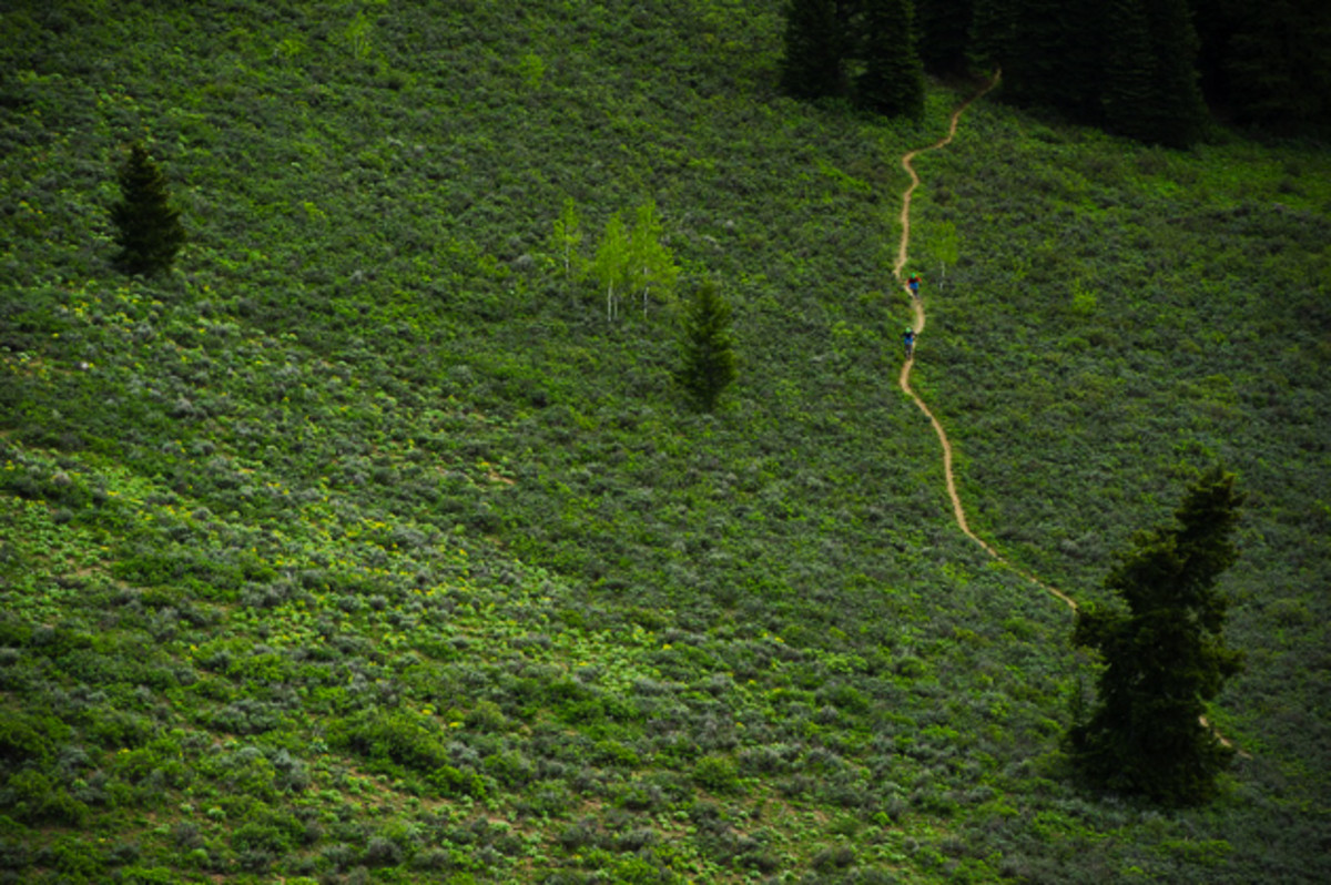 This image combines two of my favorite things: biking a perfect singletrack and a green environment. From our perch at the top of the climb, I could see the trail way below us. I asked the boys to ride down along the trail while I stayed up top. The light was in and out as they traveled, and just before they got to the trail, the clouds covered up the sunlight and provided even light for this simple shot of mountain biking in its purest form. Riders: Nick Quinn & Stu Dickson. Location: Jackson, Wyoming.