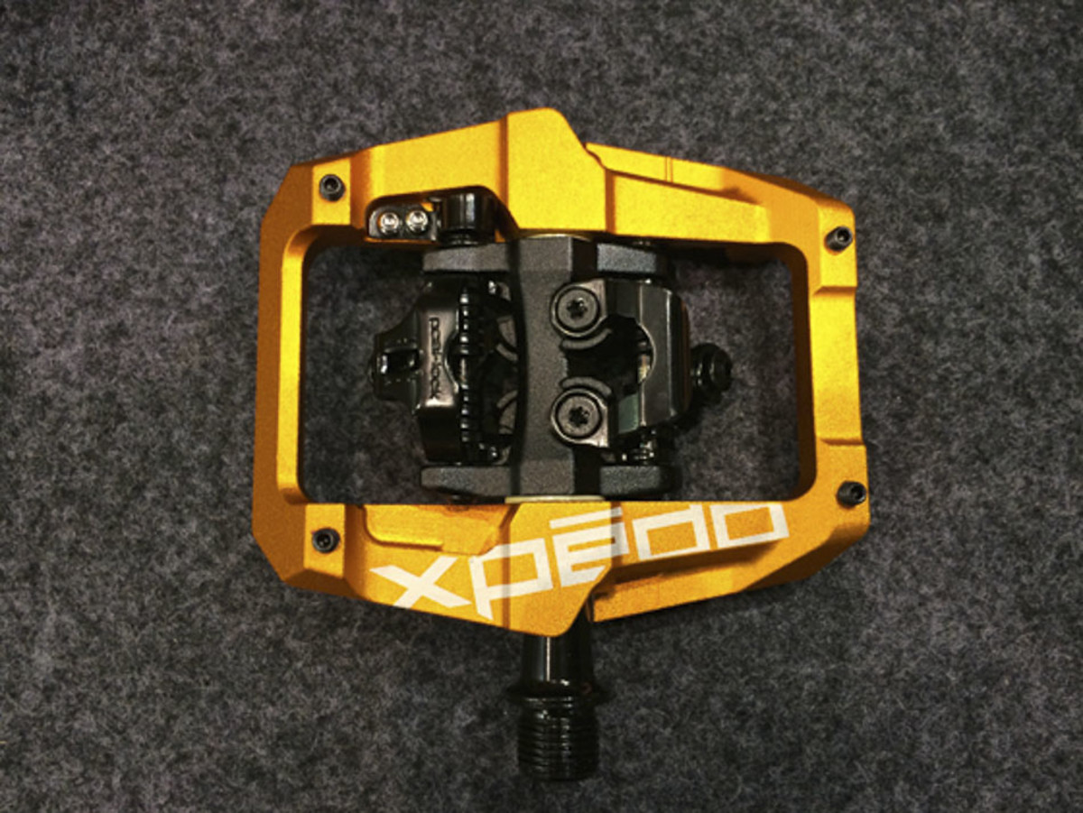 Xpedo is introducing a new clipless pedal with a forged aluminum platform cage. The pedal, which is SPD-compatible, is expected to cost $139 a pair.