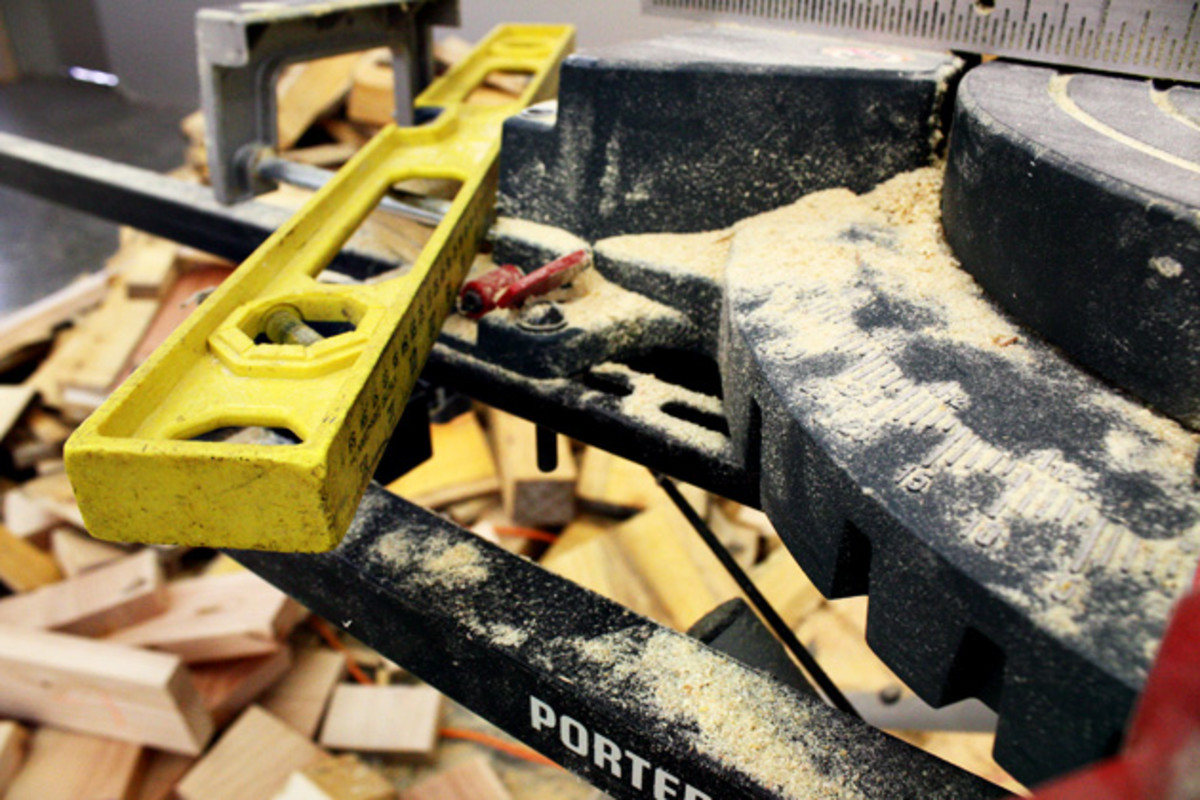 Under construction: many of the display racks are being constructed from local logs that are being milled right here in the shop by Kona employees. Here, someone gets crafty with the miter saw.
