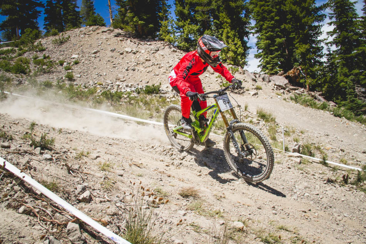 The upper section of the course switched backed across the ski run. It was dry as a bone with plenty of loose rocks to slide on. Notice Kjersti Christensen's complete lack of braking.