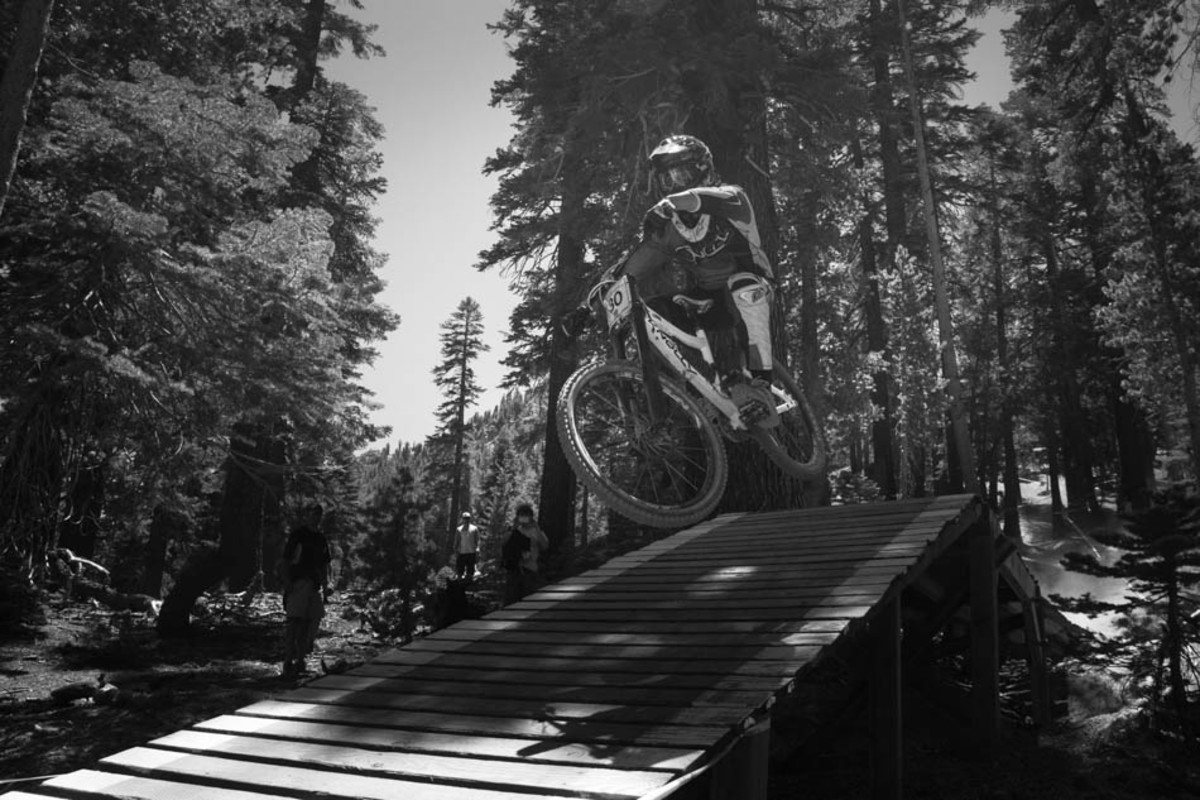 Bryan Pagel shows how to stay low. This bridge is after one of the steepest and fastest sections, and riders come into this feature with a whole lot of speed.