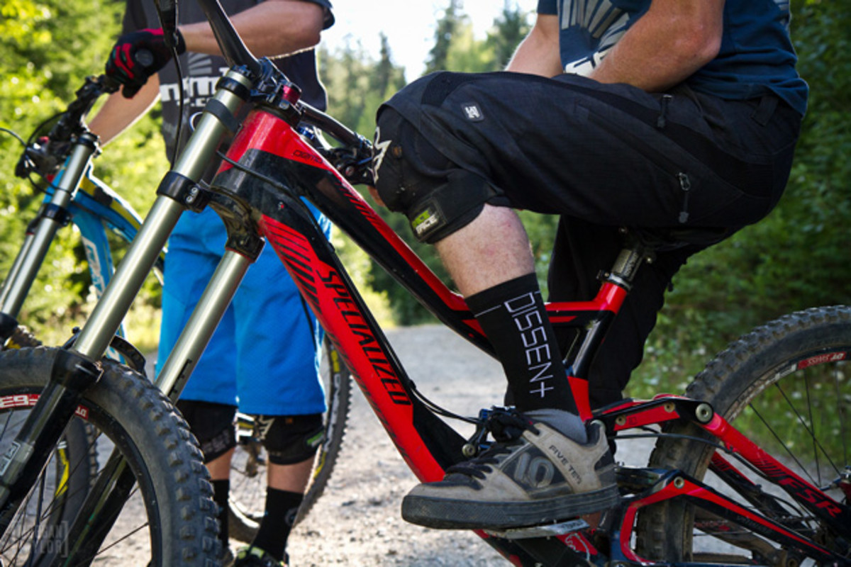 You see the insidious nature of long socks? They have a way of sneaking up on you. Note that the rider clearly misaligned the sock logo to offset the damage done by the long sock. Photo by Morgan Taylor.