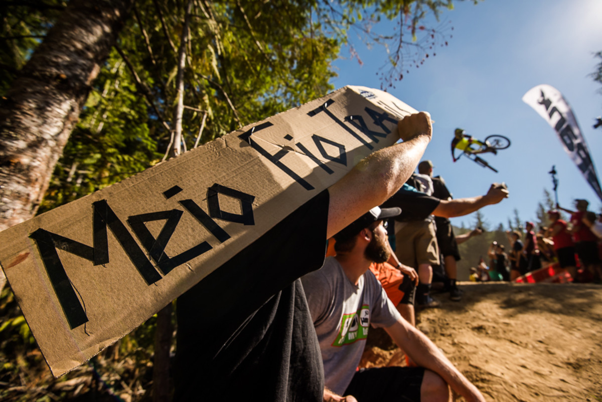 Fans from all over the world were on hand. There's a six-pack on offer for anyone who can tell us what this sign means. Photo: Bruno Long